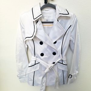 Jessica Simpson white coat with black trim.